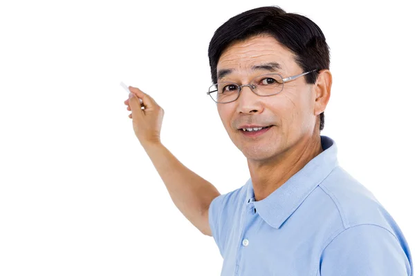 Elderly man pointing behind him — Stock Photo, Image