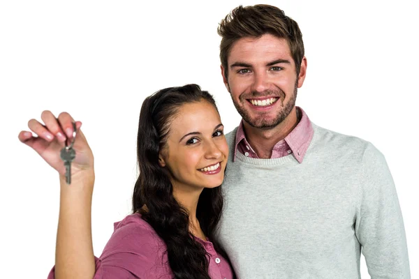 Cheerful couple holding keys — Stock Photo, Image