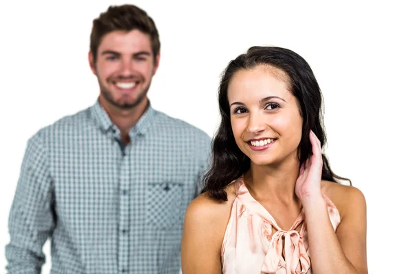 Uśmiechający się para z kobietą w planie — Zdjęcie stockowe