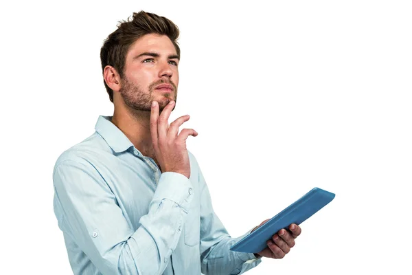Thoughtful man using tablet — Stock Photo, Image