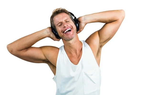 Hombre feliz escuchando música con auriculares —  Fotos de Stock