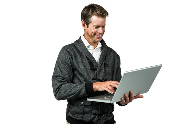 Cheerful man using laptop — Stock Photo, Image