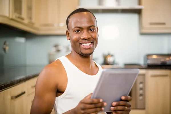 Smiling man holding tablet — Stock Photo, Image