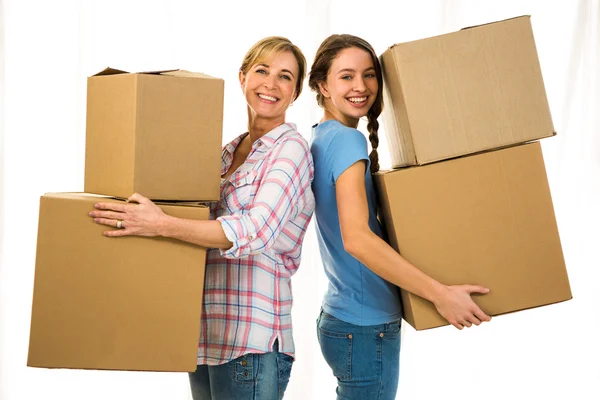 Mother and daughter holding boxes — Stock Photo, Image