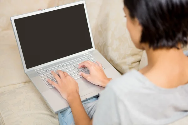 Brunette using laptop — Stock Photo, Image