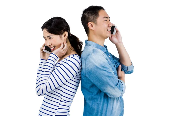 Happy couple talking on phone — Stock Photo, Image