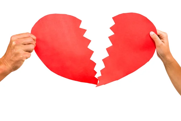 Couple hands holding red cracked heart — Stock Photo, Image