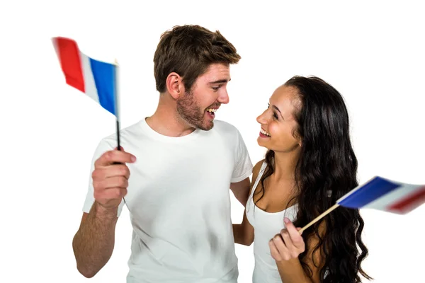 Pareja feliz sosteniendo bandera francesa — Foto de Stock