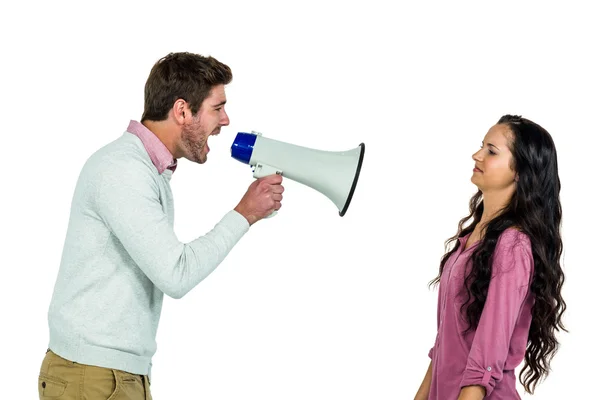 Screaming man holding loudspeaker with girlfriend — Stock Photo, Image