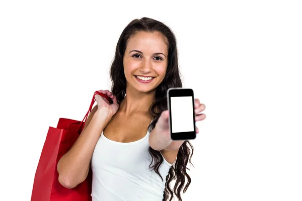 Mujer sonriente mostrando teléfono inteligente —  Fotos de Stock