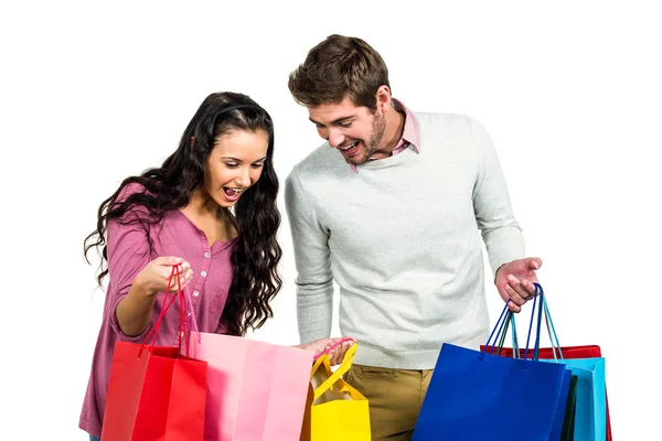 Pareja emocionada con bolsas de compras —  Fotos de Stock