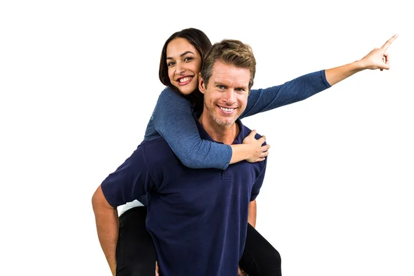 Portrait of happy man carrying girlfriend Stock Picture