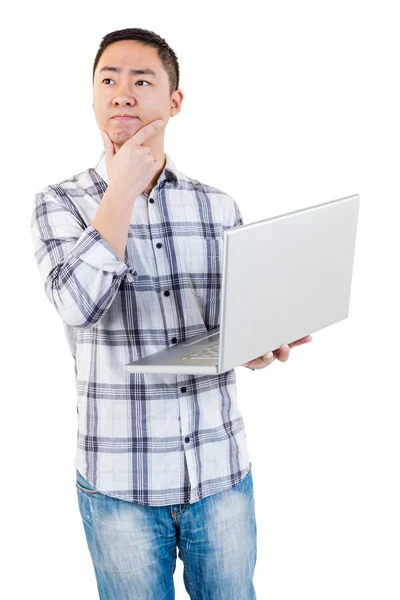 Thoughtful man holding laptop — Stock Photo, Image