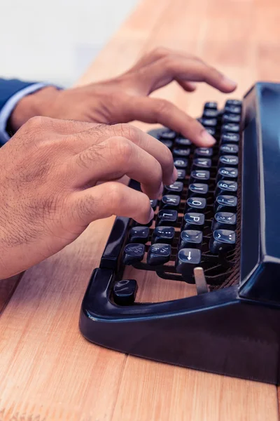 Businessman typing on typewriter — Stock Photo, Image