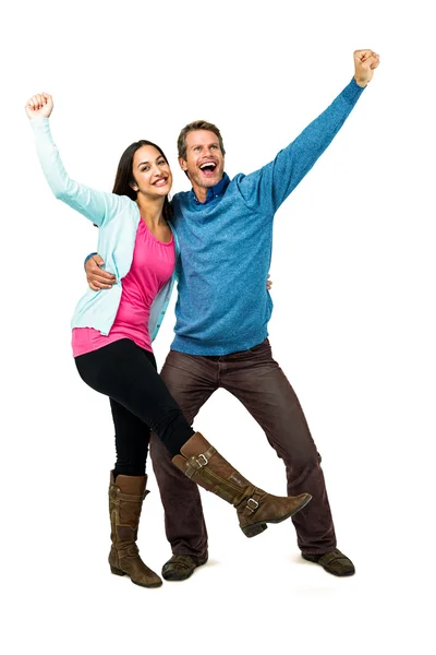 Happy successful couple with hands raised — Stock Photo, Image