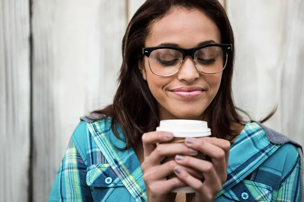 Girl smelling her coffee — Stock Photo, Image