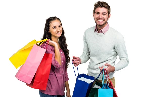 Portrait of happy couple holding shopping bag — Stock Photo, Image