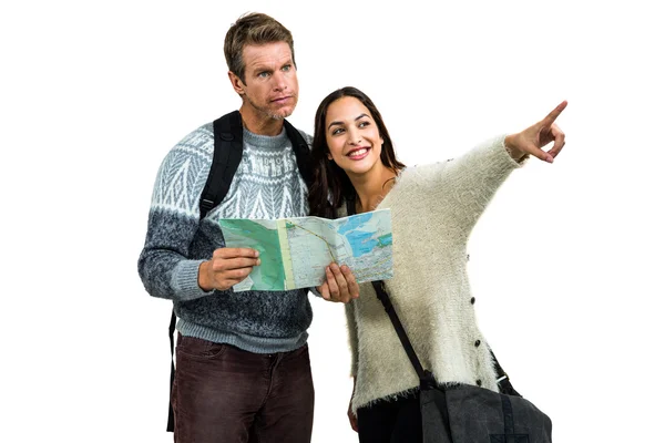 Woman traveling with boyfriend pointing while holding map — Stock Photo, Image