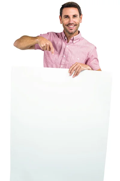 Hombre sosteniendo y señalando hoja blanca —  Fotos de Stock