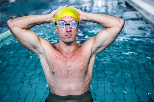 Fit swimmer holding head with hands — Stock Photo, Image