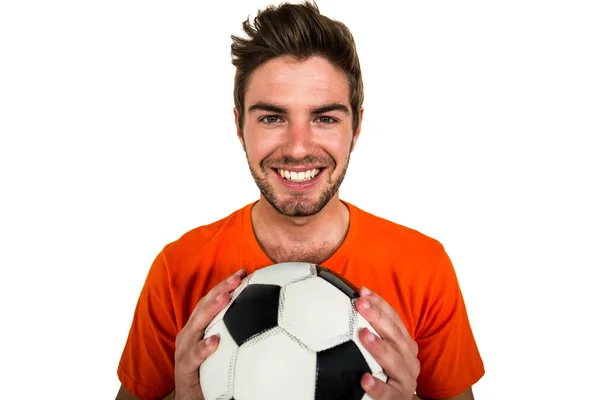 Handsome supporter holding football ball — Stock Photo, Image