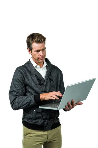 Serious man using laptop — Stock Photo, Image