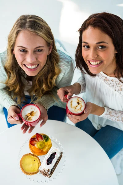 Two girls drink coffee — Stock Photo, Image