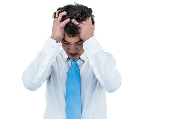 Irritato asiatico businessman holding suo testa — Foto Stock