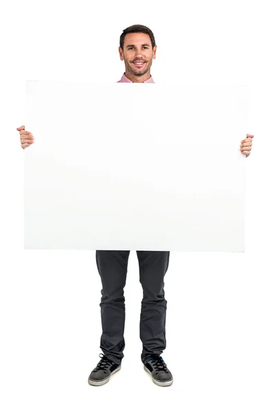 Smiling man holding white sheet — Stock Photo, Image