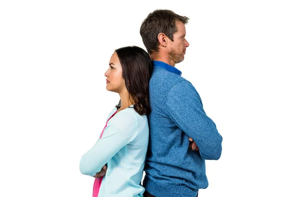 Angry couple standing back to back — Stock Photo, Image