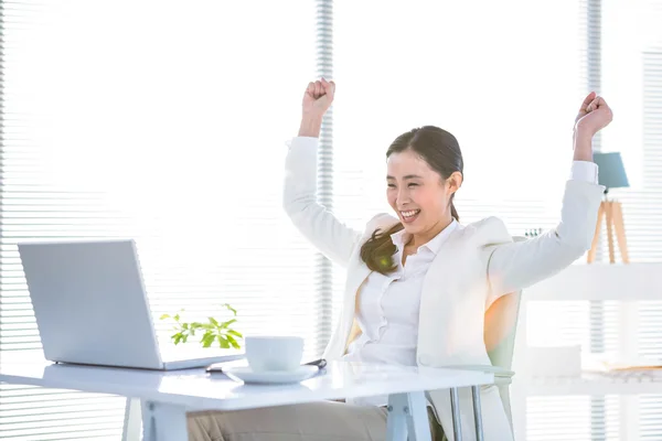 Businesswoman rejoicing with arms outstretched — Stock Photo, Image