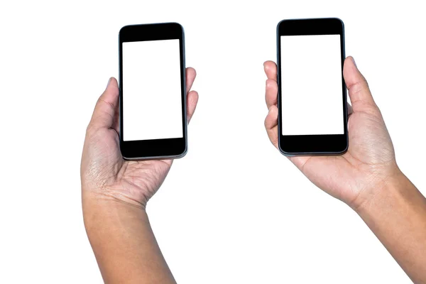Empresaria sosteniendo teléfonos inteligentes en cada mano —  Fotos de Stock