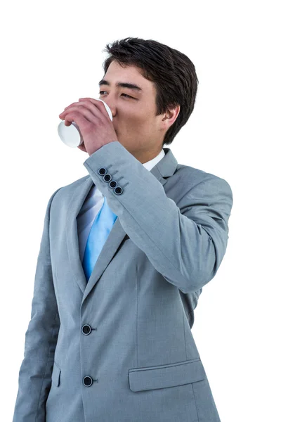 Asian businessman drinking coffee — Stock Photo, Image