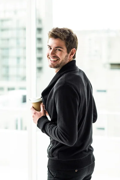 Handsome man holding disposable cup — Stock Photo, Image