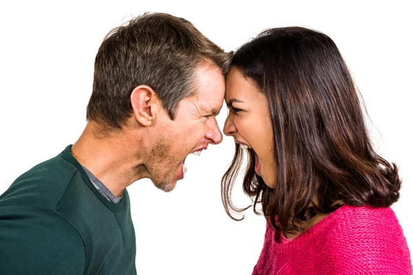 Couple yelling while standing head to head — Stock Photo, Image