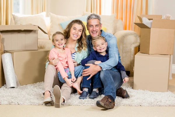 Family sitting on the carpet Stock Photo