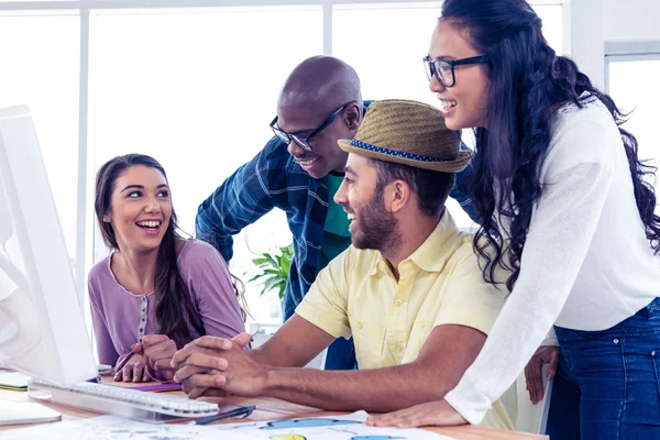 Business people laughing at desk — Stock Photo, Image