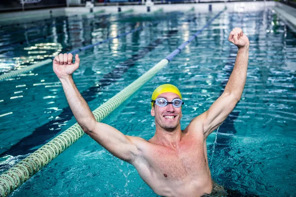 Happy swimmer put his hands up — Stock Photo, Image