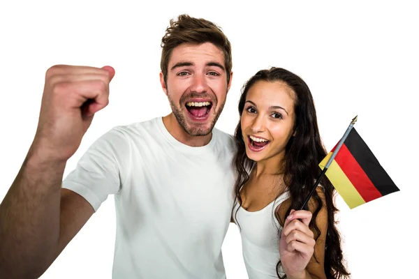 Portrait of excited couple holding German flag — Stock Photo, Image