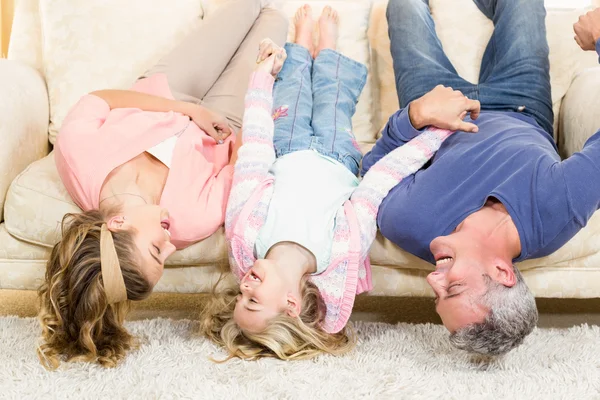 Parents and child upside down — Stock Photo, Image