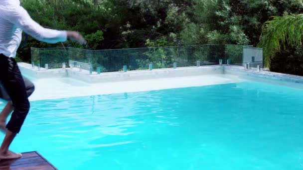 Businessman jumping in the swimming pool — Stock Video