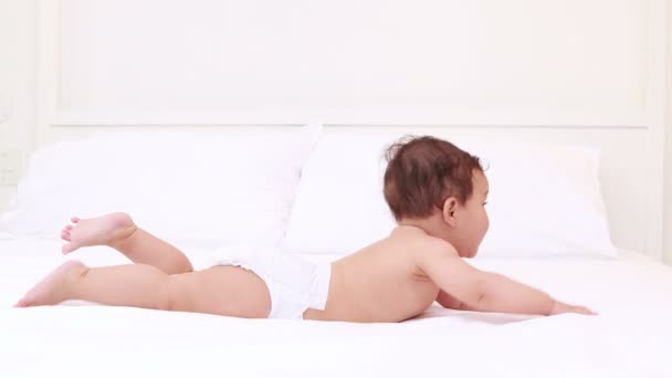 Cute baby on bed — Stock Video