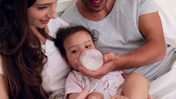 Loving parents feeding their baby — Stock Video