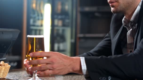 Anxious businessman drinking beer — Stock Video