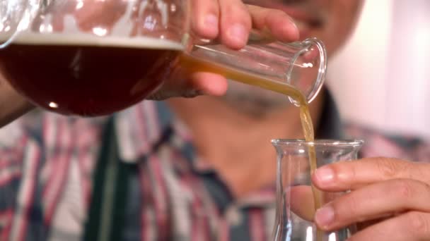 Brewery worker checking the product — Stock Video