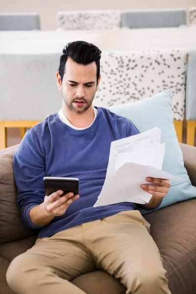 Handsome man counting bills — Stock Photo, Image