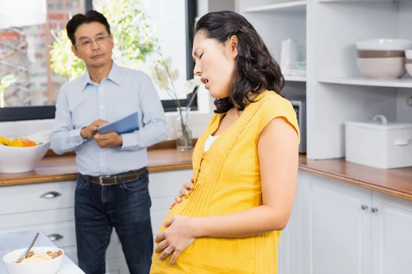 Suffering pregnant woman touching belly — 스톡 사진