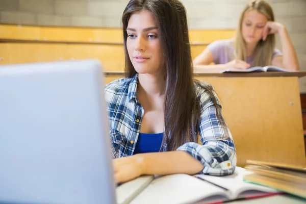 Smiling students working in class — ストック写真