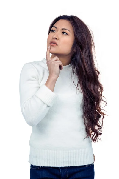 Thoughtful Asian woman with finger on chin — Stock Photo, Image