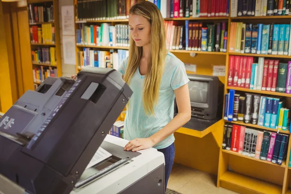 Blonde student making copy — Stock Photo, Image